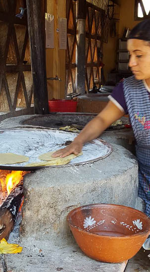Woman Making Tortillas by Lara Gularte 